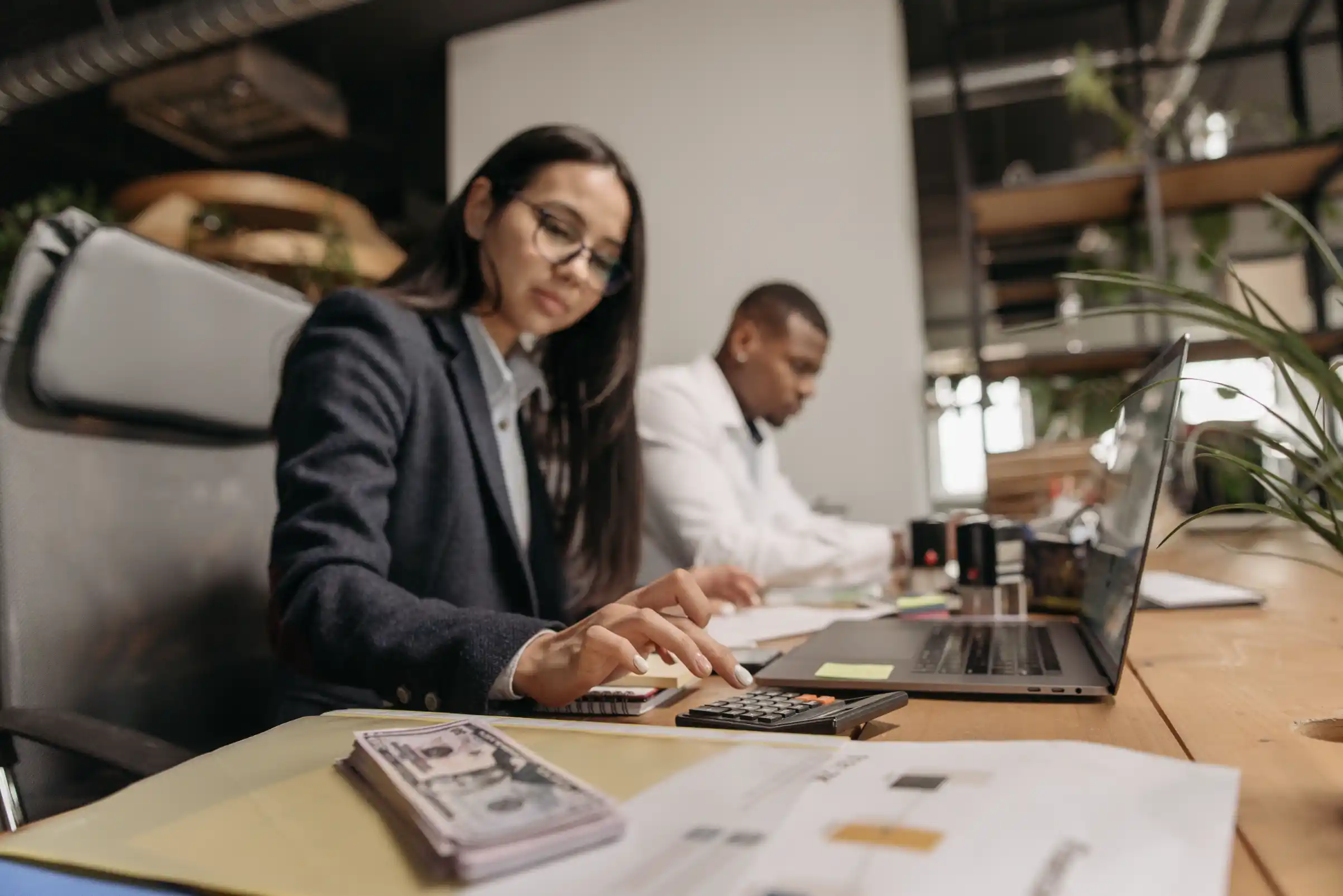 An accountant meeting small business owners to review their needs