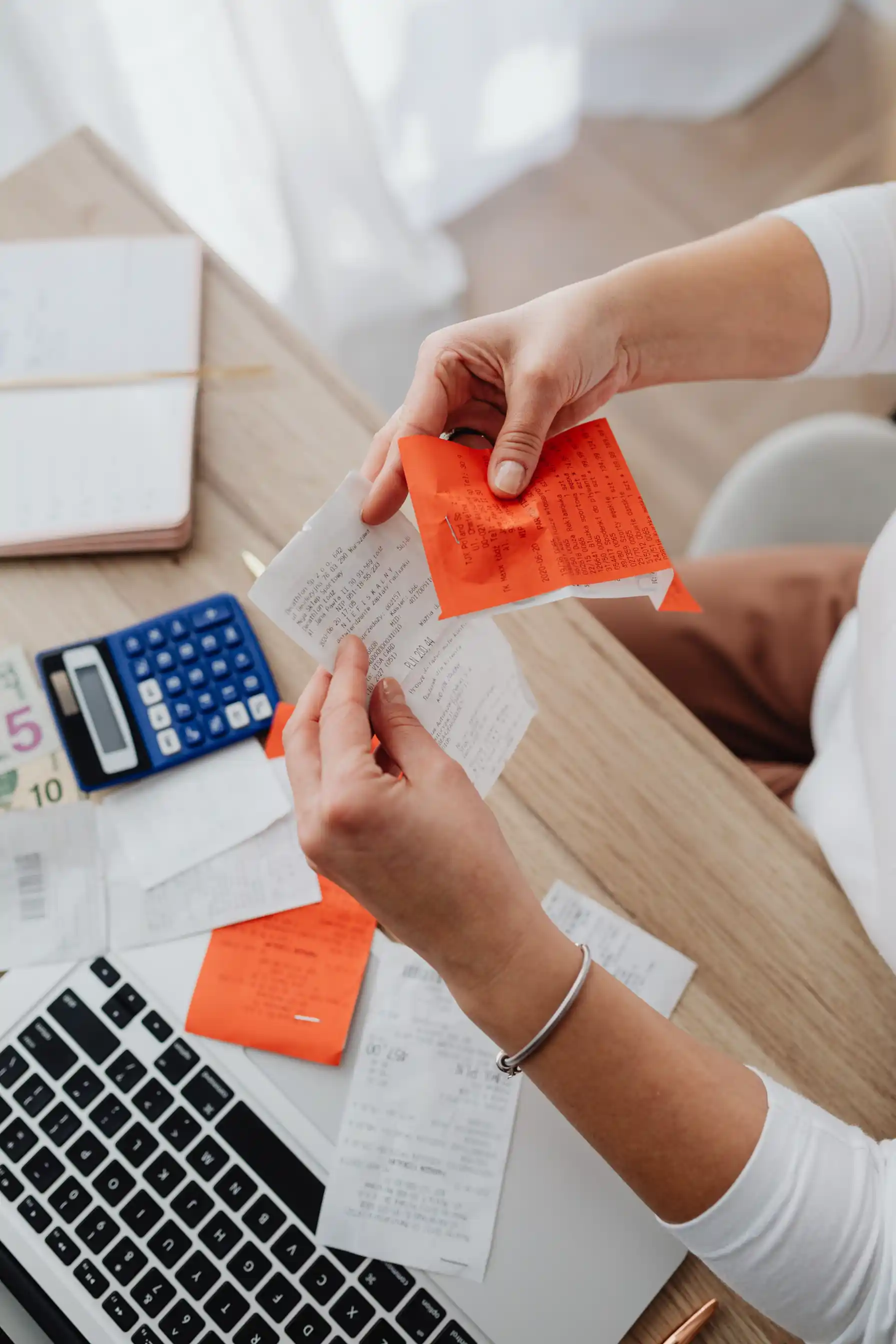 An accountant reviewing financial documents and figures