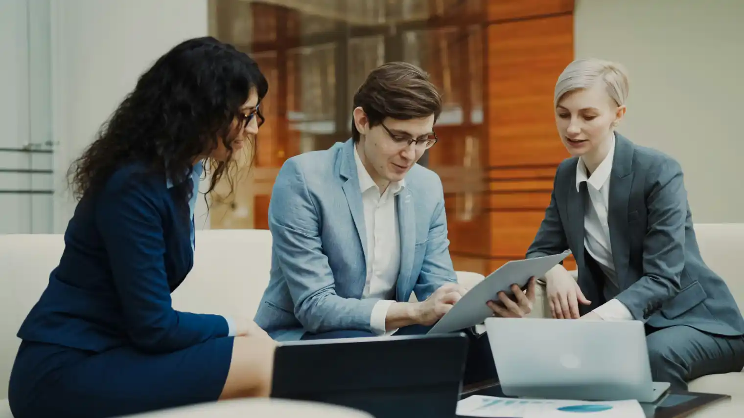 Client stakeholders and advisers reviewing options together in a meeting room